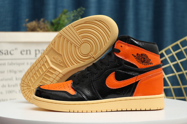 orange and black jordan basketball shoes